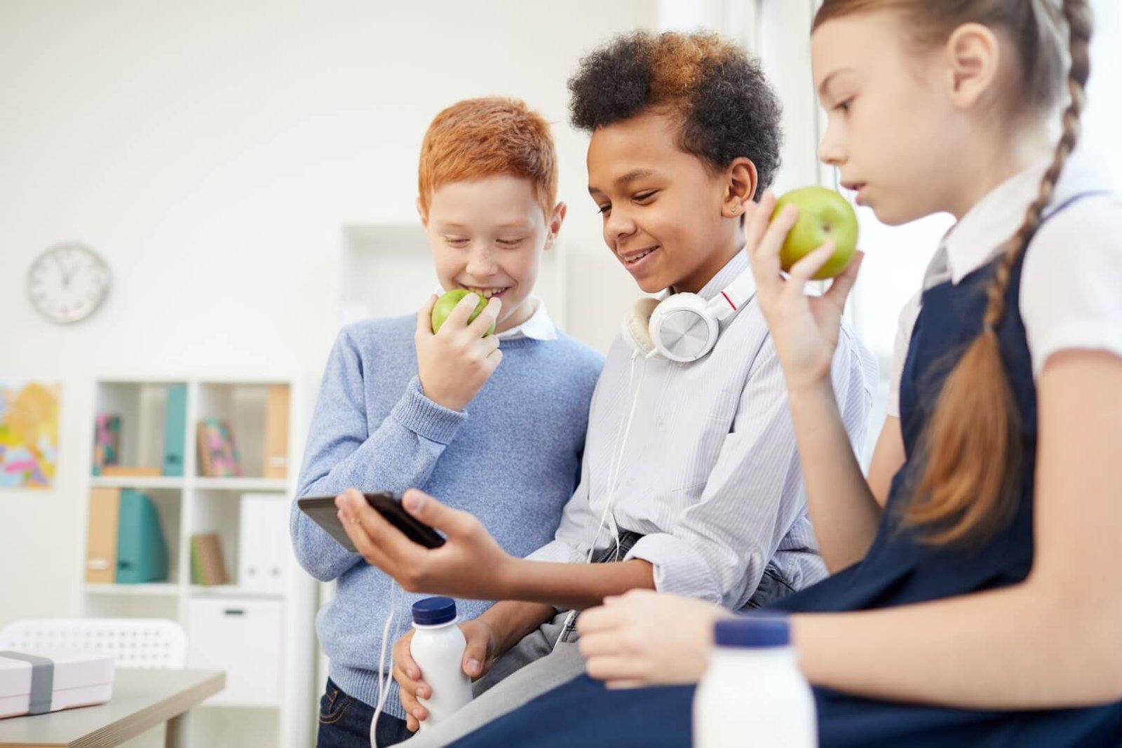school-children-using-phone-at-school.jpg